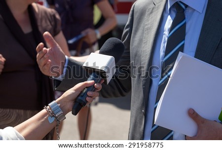 Reporter making interview