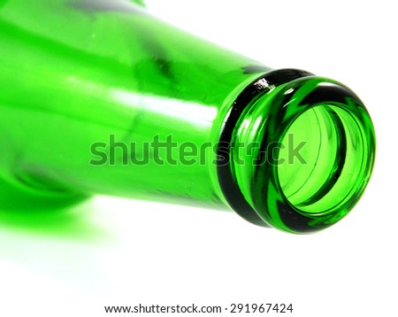 empty green glass bottle lying on its side isolated over white background