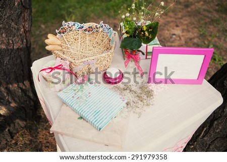 Beautiful decor on the table with a photo frame and flowers