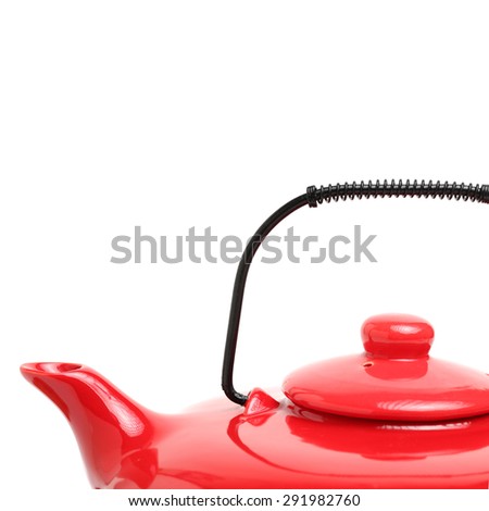 Red teapot on white background