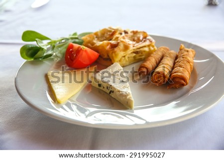 Cheese and pastry with tomato and herbs