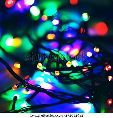 defocused electric garland with red, green and blue lights