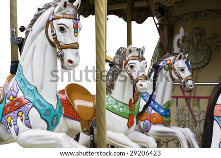 Horses on a carousal.  The background has been removed to enable the designer to do a little more with the picture.