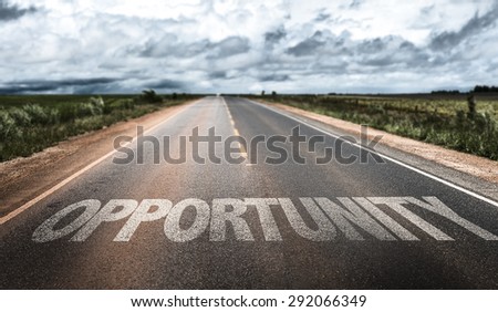 Opportunity written on rural road Royalty-Free Stock Photo #292066349
