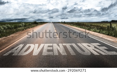 Adventure written on rural road