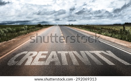 Creativity written on rural road