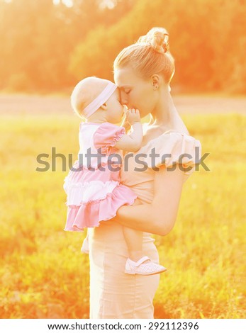 Happiness mother! Sunny portrait of happy mom and baby together on beautiful sunset sunlight