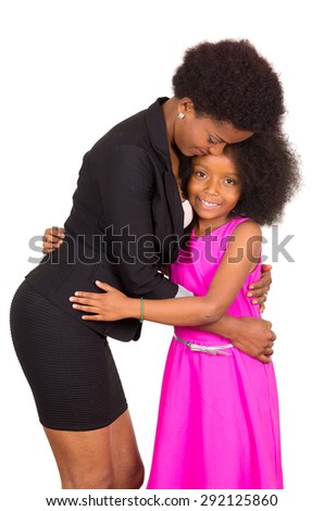 Black mother daughter embracing each other in a hug and smiling