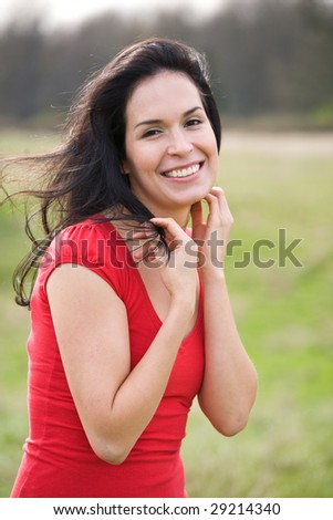 A shot of a beautiful hispanic woman outdoor in summer
