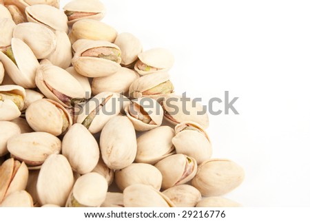 Close-up pistachios isolated on a white background.