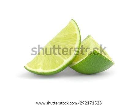 fresh lime wedge isolated on a white background. Royalty-Free Stock Photo #292171523