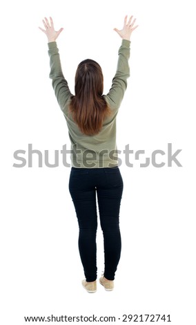 Back view of Beautiful woman looking at wall and Holds  hand up. young girl standing. Rear view people. Isolated over white background. Woman pulls a hand with fingers spread upward in prayer