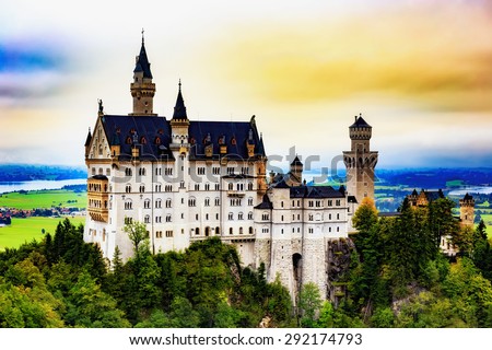 Neuschwanstein Castle, Lovely Autumn Landscape Panorama Picture of the fairy tale castle near Munich in Bavaria, Germany. Sunrise on a cloudy september day