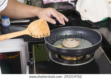 Beef Burger deep fried in the pan / cooking Hamburger concept