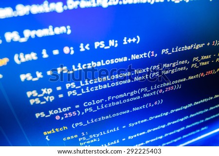 Software developer programming code on computer. Abstract computer script source code.  Shallow depth of field, selective focus effect. (MORE SIMILAR IN MY GALLERY)