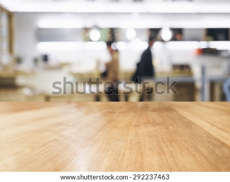 Table top with Blurred People and Shop interior background