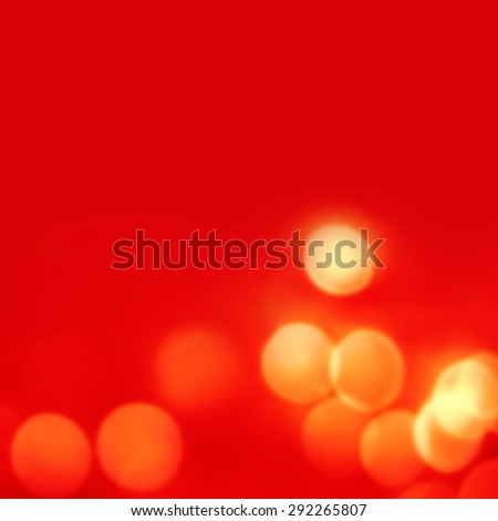 Abstract Red  Christmas background with golden  bokeh lights  and place for text. Beautiful Festive textured  background. Vintage defocused background.