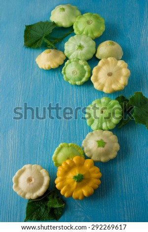 Fresh organic seasonal vegetables - pumpkin, squash, on wooden background