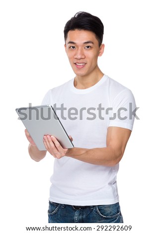 Young man use of the digital tablet