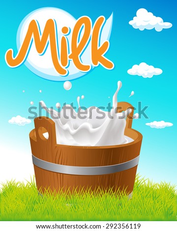 wooden pail with milk tag, green grass and blue sky