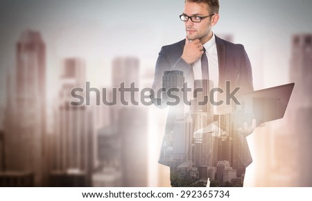 portrait of double exposure businessman and city working with laptop