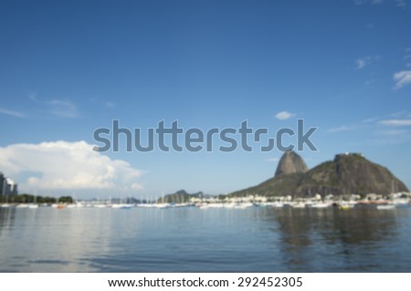 Defocused abstract view of Sugarloaf Mountain and Rio de Janeiro Brazil skyline reflecting on Botafogo Bay