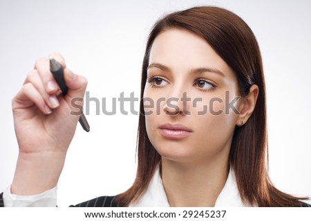 Young business woman writing on glass close up