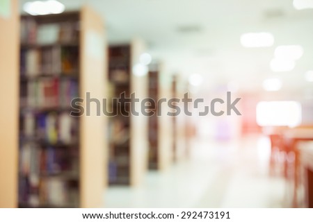 books on bookshelf in library, abstract blur defocused background Royalty-Free Stock Photo #292473191