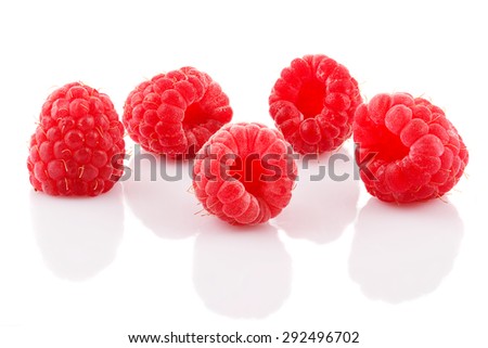 A bunch of ripe raspberries on white background.