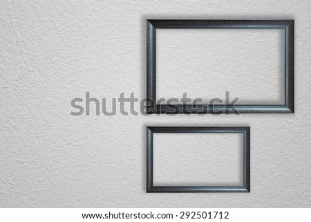 wooden frame on white concrete wall
