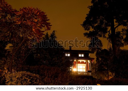 A house with spooky lighting, taken late at night.