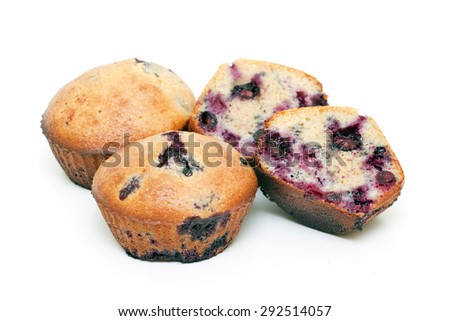  Muffins with berries isolated on a white background