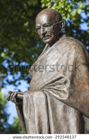 Statue of historic leader Mahatma Gandhi in Parliament Square, London. Royalty-Free Stock Photo #292548137