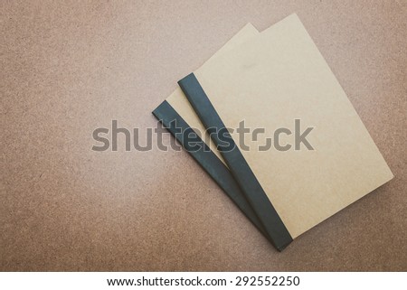 Notebook mock up on wood background - vintage filter