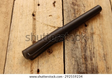 pen on the wooden table
