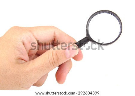 Man's hand holding magnifying glass, closeup isolated on white background