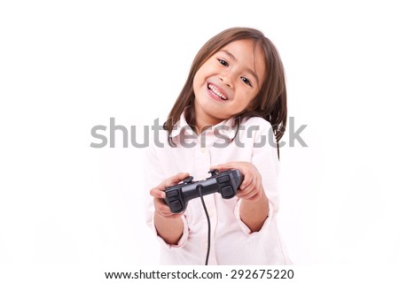 happy little girl gamer playing video game