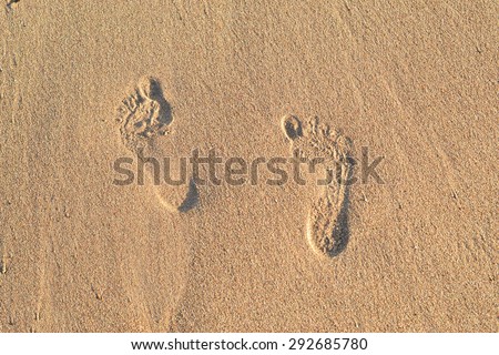 Footprint on sand on the beach ocean
