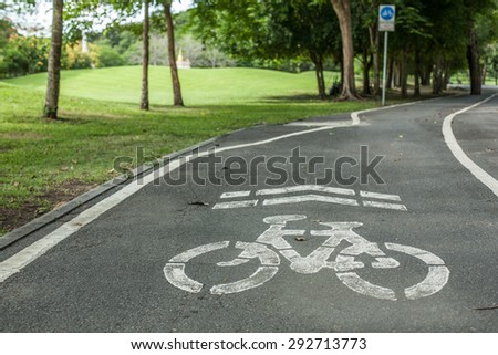 sign of bike road in a park