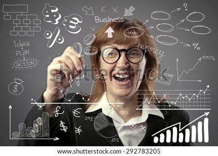 businesswoman holding pen and drawing graphics