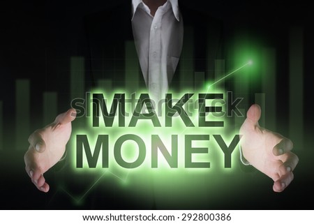 Glowing text "Make money" in the hands of a businessman. Business concept. Internet concept. 