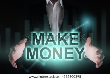Glowing text "Make money" in the hands of a businessman. Business concept. Internet concept. 