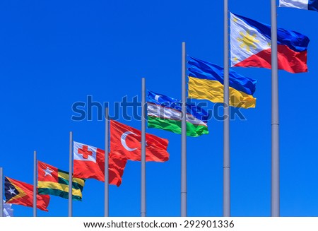Flags against blue sky
