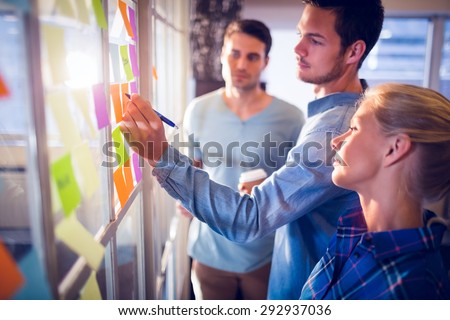Young creative business people at office Royalty-Free Stock Photo #292937036