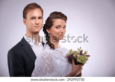 Portrait of young man and woman retro wedding studio
