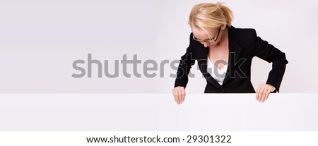 Businesswoman holding blank sign isolated on white
