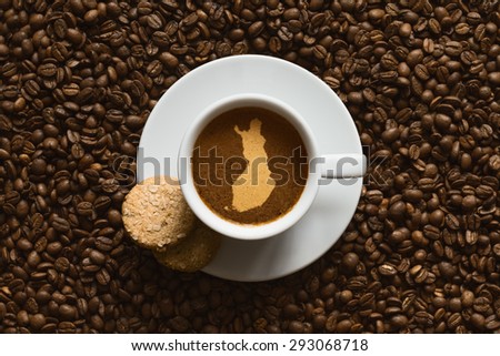 Still life photography of hot coffee beverage with map of Finland