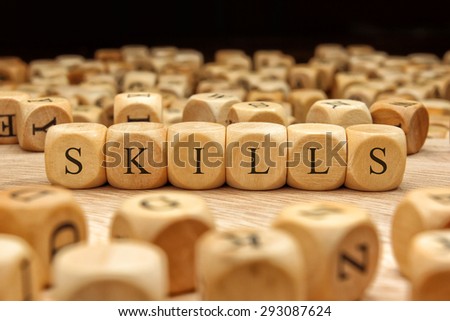 SKILLS word written on wood block