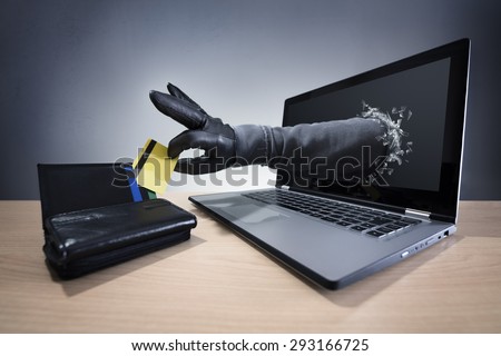 Stealing a credit card through a laptop concept for computer hacker, network security and electronic banking security Royalty-Free Stock Photo #293166725