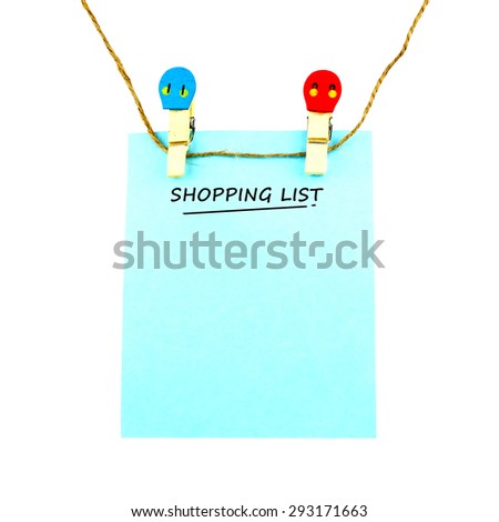 Blue note with word "SHOPPING LIST" hanging against white background